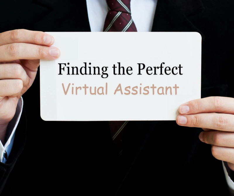 a person holding a sign for finding the perfect virtual assistant
